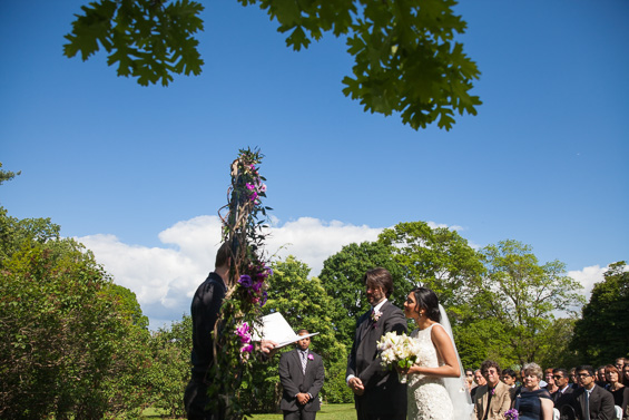 Daniel Fugaciu Photography - bride and groom under flowers arbor at tyler arboretum wedding