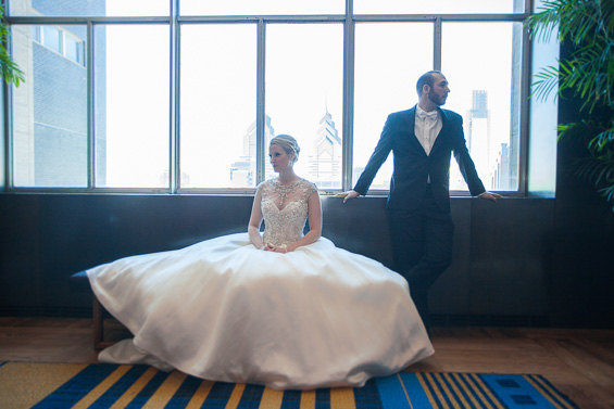 bride and groom at the Lowes Hotel - Crystal Tea Room Wedding - photo: Daniel Fugaciu Photography | via https://emmalinebride.com