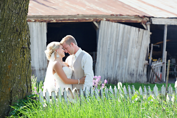 KimAnne Photography - iowa backyard wedding - bride-groom-picket-fence