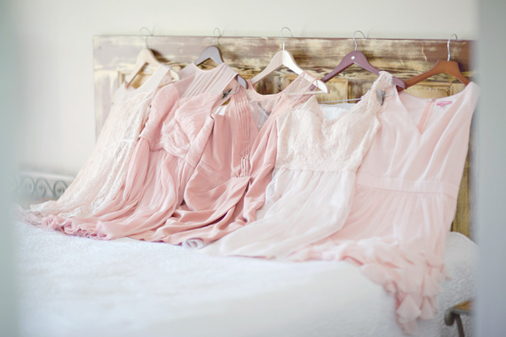 Kali Norton Photography - Mandeville Spring Wedding - bridesmaid dresses on the bed