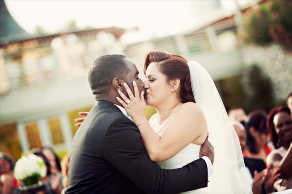 Imagine Studios - bride and groom kiss after saying I do