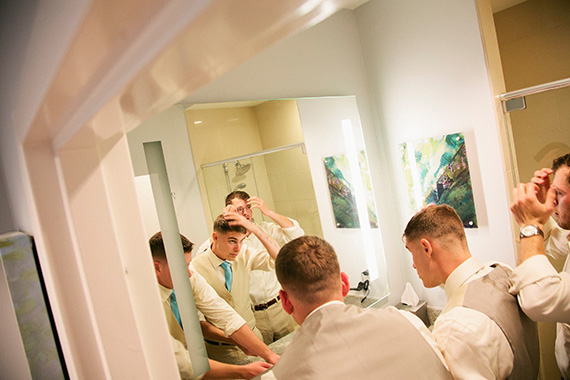 Tate Tullier Photography - Baton Rouge Wedding - groomsmen-looking-in-mirror-getting-ready