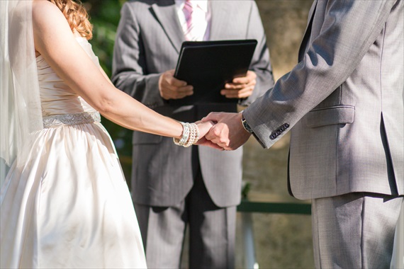 Filda Konec Photography - bride and groom hold hands