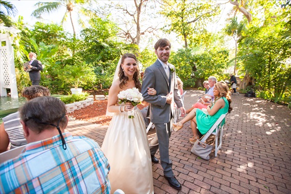 Filda Konec Photography - bride and groom walk up aisle married at hemingway house
