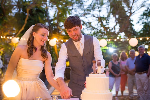 Filda Konec Photography - bride and groom cut wedding cake
