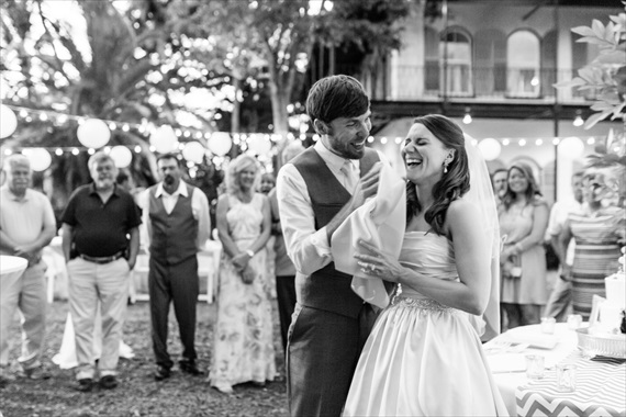 Filda Konec Photography - bride and groom laugh with wedding cake at key west wedding