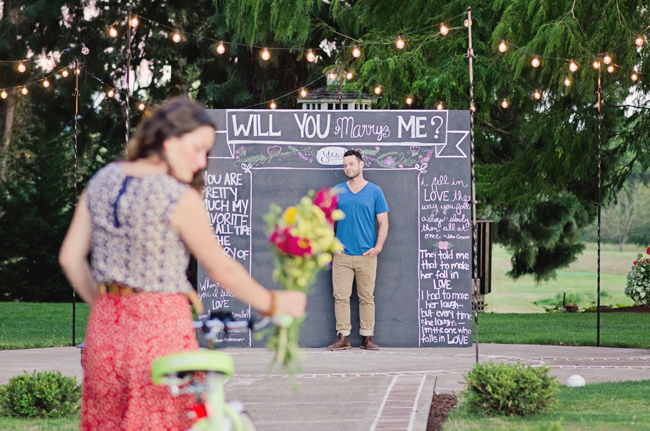 will you marry me chalk board sign with couple| Photo: White Ivory Photography | via https://emmalinebride.com/real-weddings/hipster-engagement-session-what-does-one-look-like/