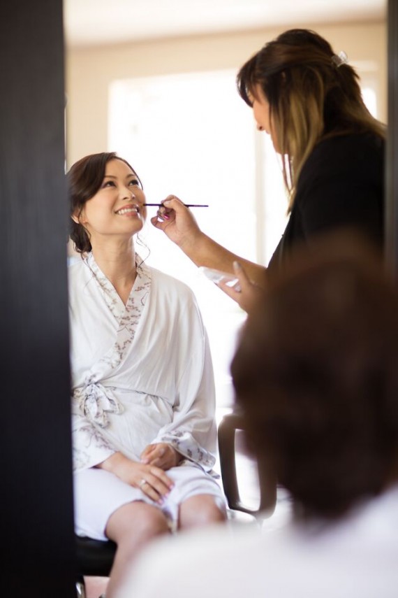 Winery Styled Wedding Shoot - The Bride in Robe Getting Makeup Done