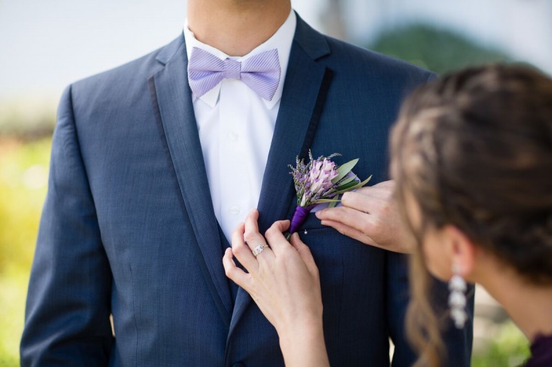 Winery Style Wedding Shoot - The Groom Putting on Boutonniere (photo: olivia smartt) https://emmalinebride.com/themes/winery-style-wedding/