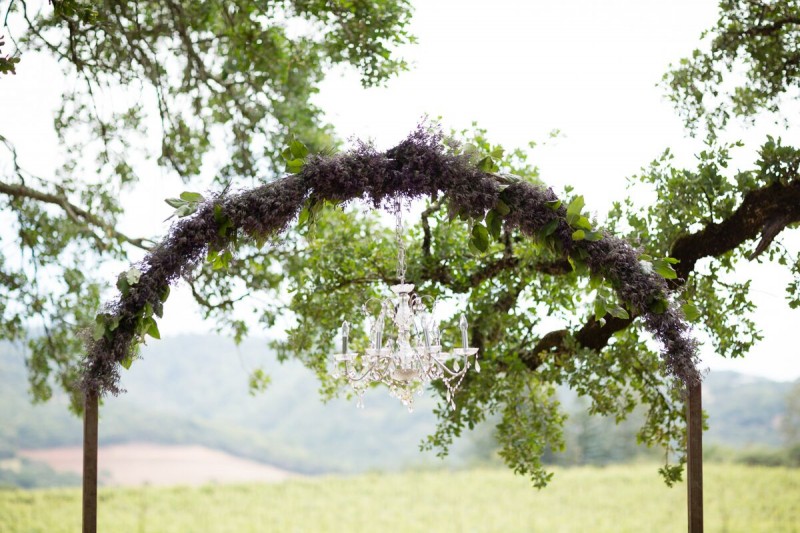 Winery Style Wedding Shoot - ceremony arch with chandelier (photo: olivia smartt) https://emmalinebride.com/themes/winery-style-wedding/