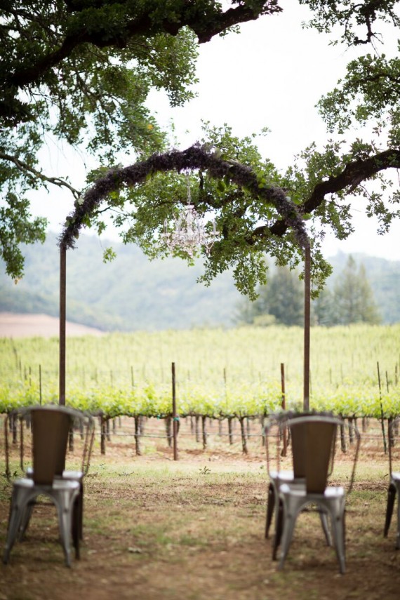Winery Styled Wedding Shoot - wedding ceremony in winery with chandelier and arch