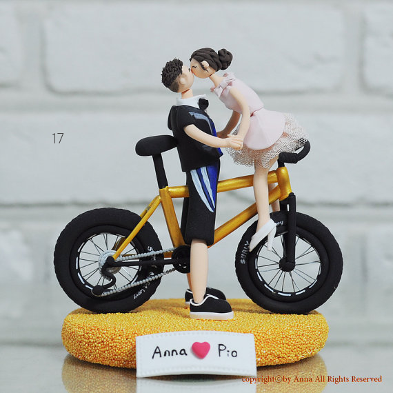 bicycle themed wedding - custom couple cake topper on bicycle