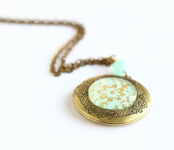 Wrap this handmade wedding locket around your bouquet as 'something blue'.  After the wedding, fill with your favorite photos and wear on your honeymoon.  By Jacaranda Designs.