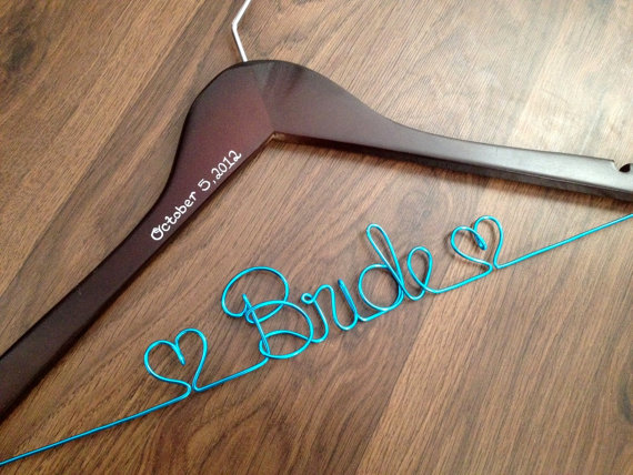 bride dress hanger | via 10 NEW Something Blue Ideas | https://emmalinebride.com/bride/new-something-blue/