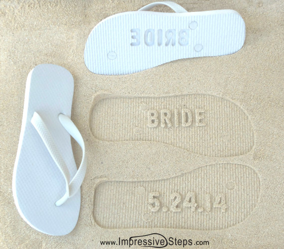 These flip flops are customized with your wedding date.  When you walk on the shore, your date will be imprinted into the sand. Cute! | via 31 Best Handmade Wedding Shoes https://emmalinebride.com/bride/handmade-wedding-shoes/