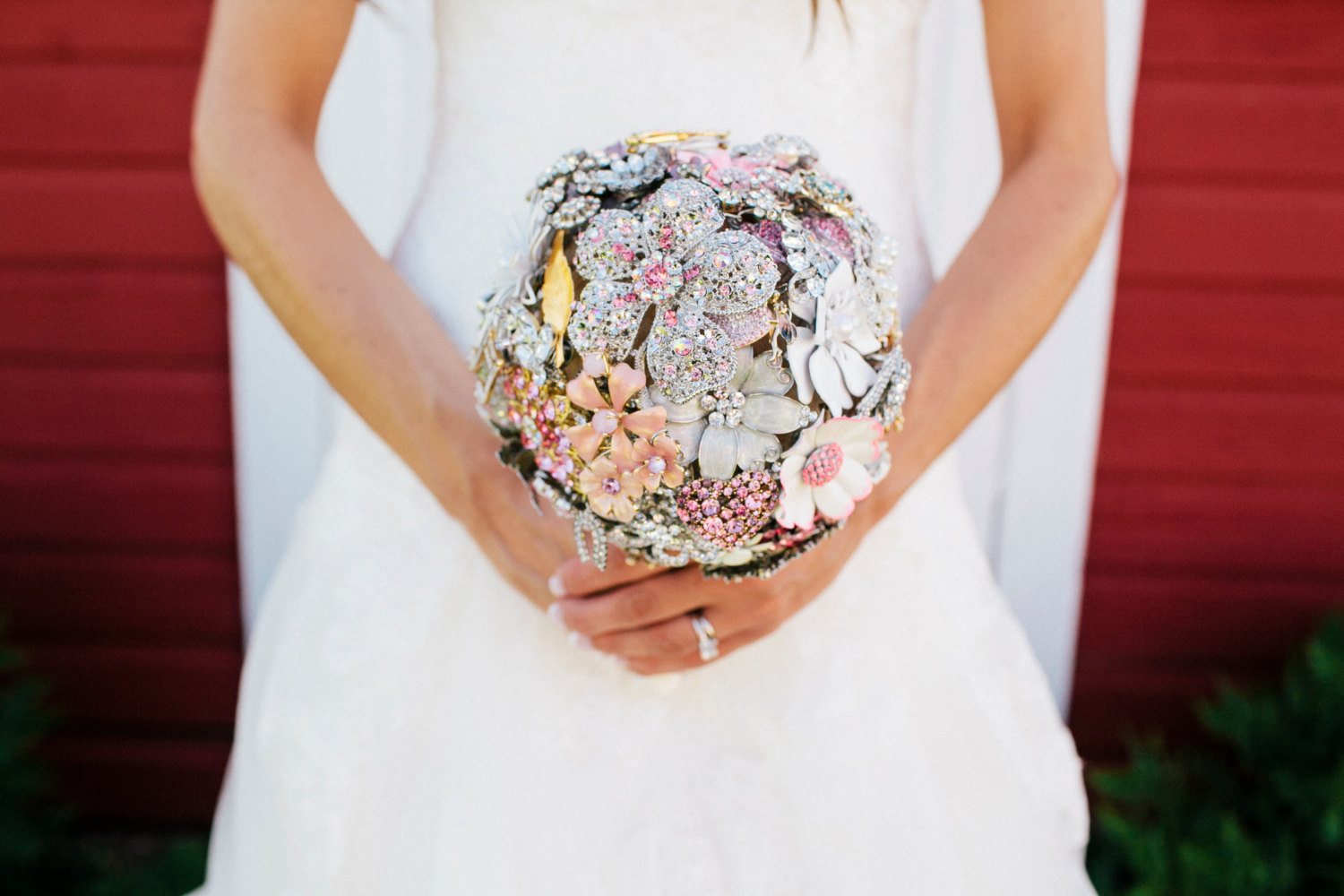 bride holding brooch bouquet