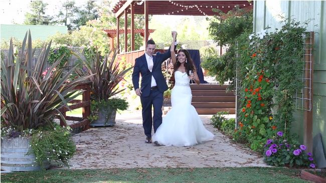 bride and groom wedding entrance in their Sova Gardens wedding film