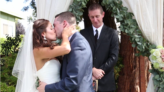bride and groom kiss at their Sova gardens Wedding film