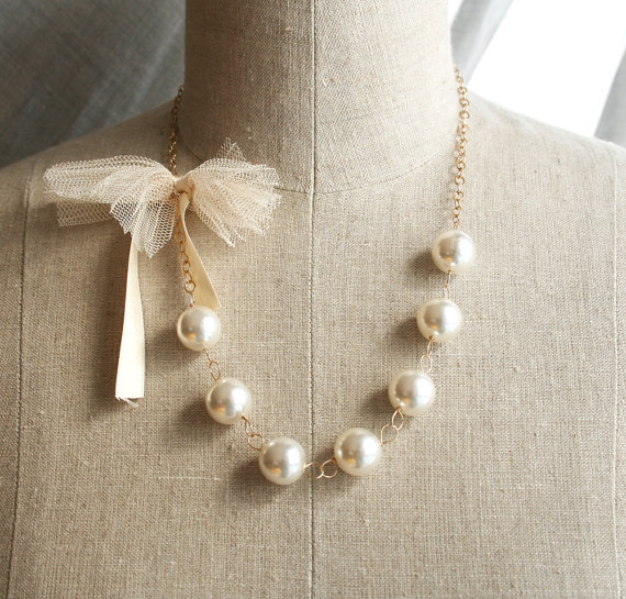 Cream and Gold Wedding Ideas: bridesmaid necklace with tulle bow (by Laura Stark)