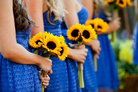 bridesmaids holding sunflower wedding bouquets