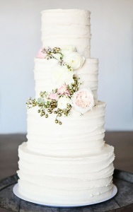 buttercream wedding cake ivory and pink flowers