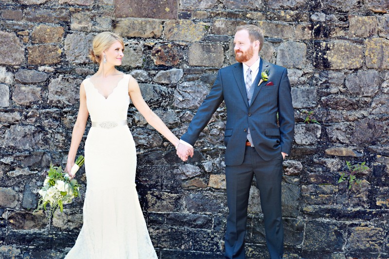 Bride and Groom Holding Hands | Photo: Melissa Prosser Photographer | https://emmalinebride.com/real-weddings/colleen-ryans-lovely-savannah-wedding-at-the-mansion-on-forsyth-park/