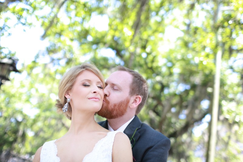 Groom kissing his bride | Photographer: Melissa Prosser Photography | via https://emmalinebride.com/real-weddings/colleen-ryans-lovely-savannah-wedding-at-the-mansion-on-forsyth-park