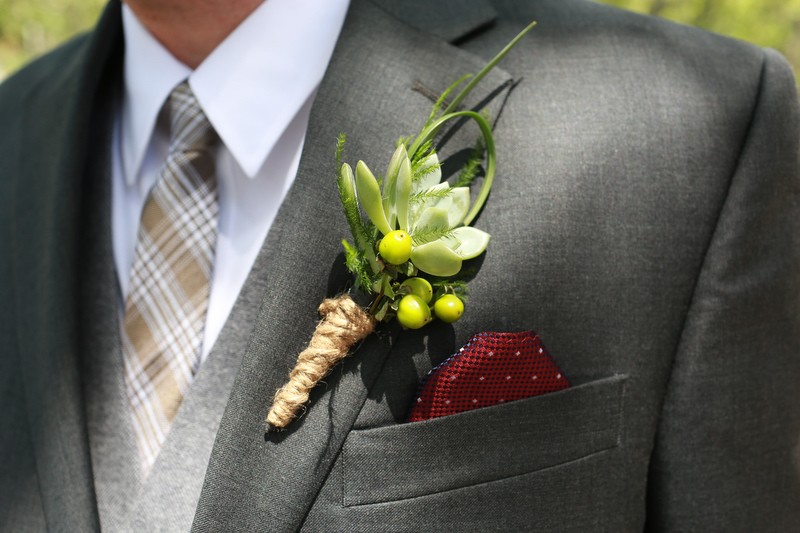 The groom's boutonniere included a succulent and was wrapped in jute twine. | Photographer: Melissa Prosser Photography | via https://emmalinebride.com/real-weddings/colleen-ryans-lovely-savannah-wedding-at-the-mansion-on-forsyth-park
