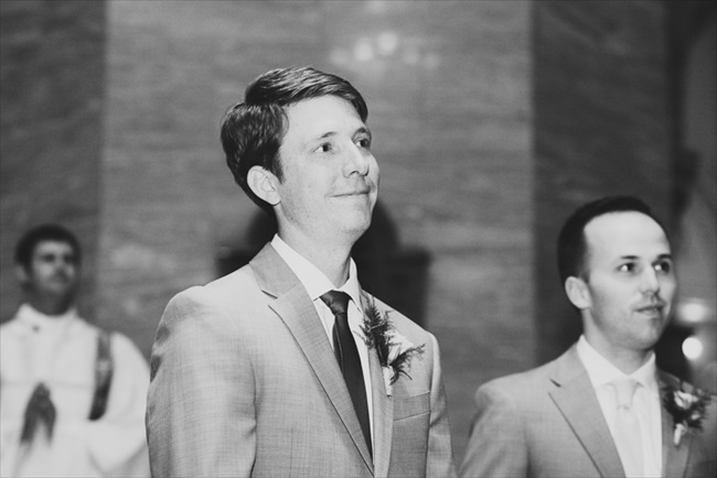 The groom watches as the bride walks down the aisle | Photo: Searching for the Light Photography LLC | via https://emmalinebride.com/real-weddings/colorado-chic-wedding-kendall-brian/