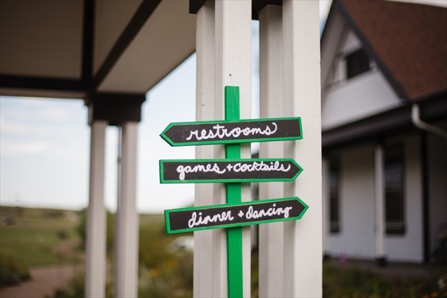 Signs leading the way for the wedding | Photo: Searching for the Light Photography LLC | via https://emmalinebride.com/real-weddings/colorado-chic-wedding-kendall-brian/