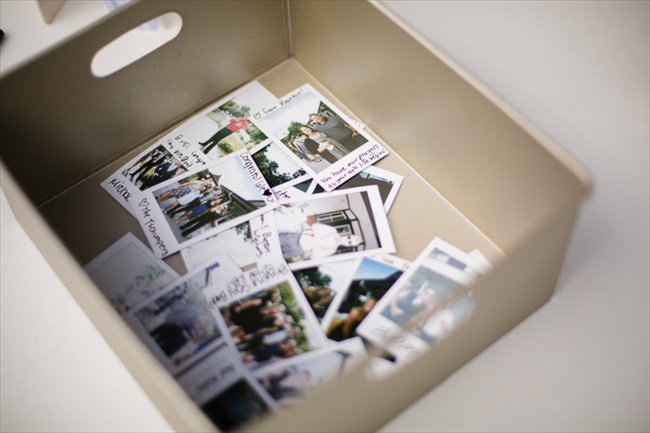 Guests snapped polaroid photos and wrote notes and their names on them, in lieu of a traditional guest book | Photo: Searching for the Light Photography LLC | via https://emmalinebride.com/real-weddings/colorado-chic-wedding-kendall-brian/
