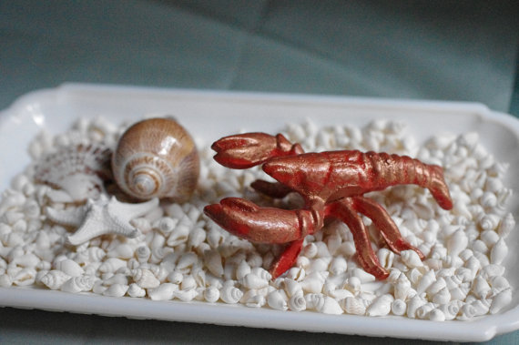 10 Beach Wedding Centerpieces via EmmalineBride.com - crawfish paperweight cast iron by By The Seashore