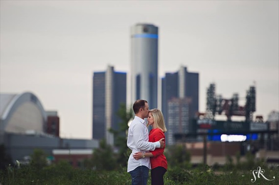 Downtown Detroit engagement photo in front of GM Renaissance Center, Comerica Park, Ford Field
