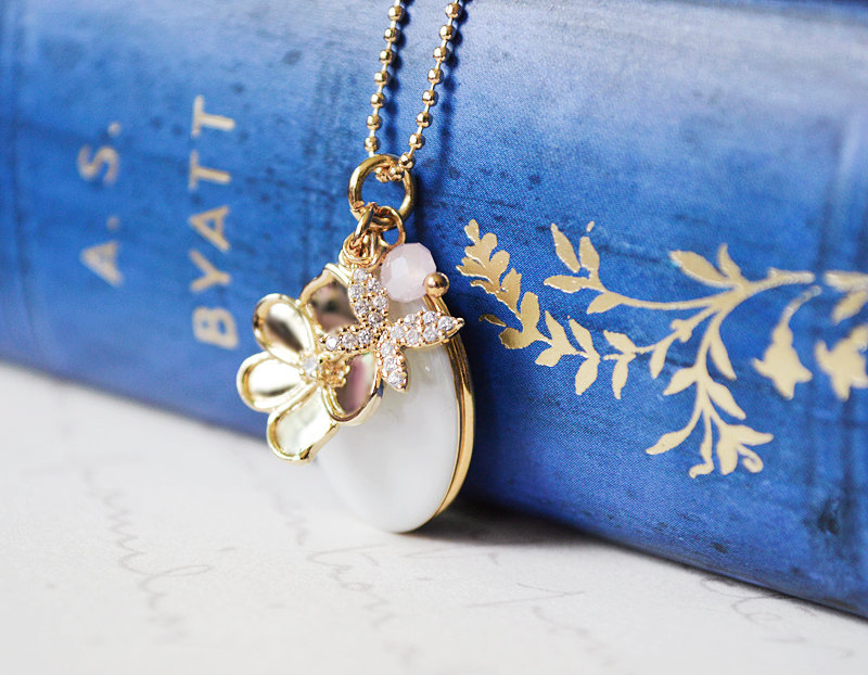 enameled gold locket with flowers via Easy Bridesmaid Gift They'll Really Love via https://emmalinebride.com/gifts/easy-bridesmaid-gift/