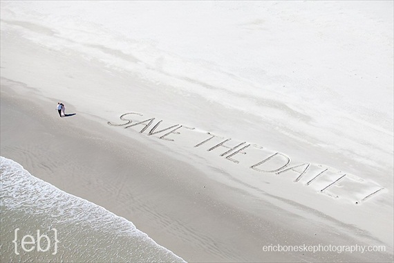 20 Best Engagement Photo Ideas: The Ocean + Save the Date Written in the Sand (by Eric Boneske)