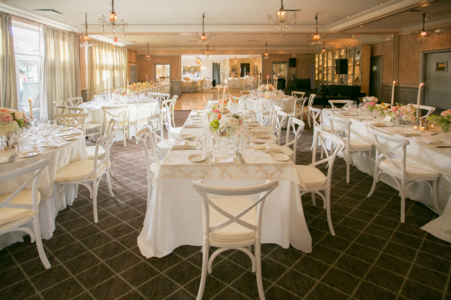 reception decor and table settings at Connecticut waterfront wedding - photo: Melani Lust Photography | via https://emmalinebride.com