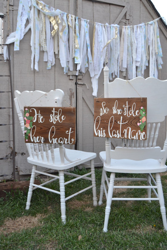 he stole her heart chair signs | via bride and groom chair signs https://emmalinebride.com/decor/bride-and-groom-chairs/