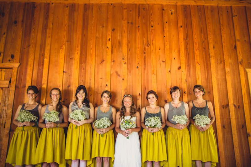These bridesmaid skirts feature a hi low hem and are available in a variety of colors.  These mustard yellow ones are my favorite! | https://emmalinebride.com/bridesmaids/bridesmaid-skirts-hi-low-hem/