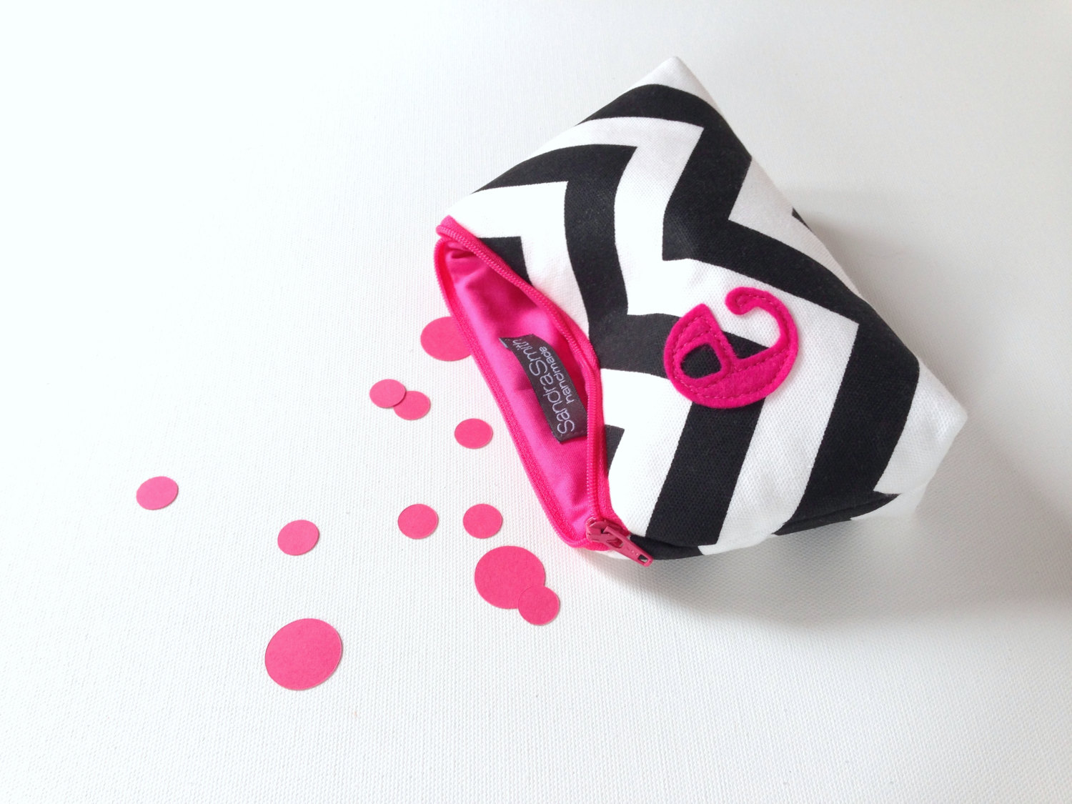 hot pink and black cosmetic bag by sandra smith handmade | fun bachelorette party ideas | https://emmalinebride.com/planning/fun-bachelorette-party-ideas/