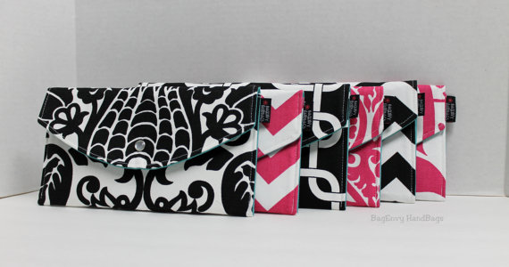 Hot Pink and Black Mismatched Clutches - pick a purse each bridesmaid will love in a particular color with her own unique pattern or print.