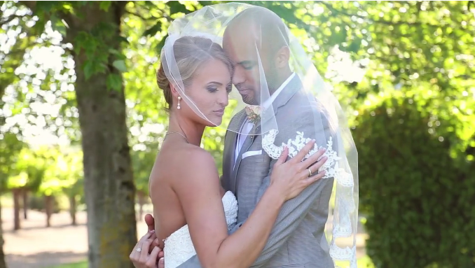 bride and groom under veil in their wine country wedding video