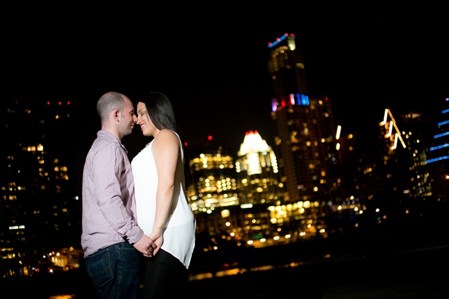 couple under the city skyline at their Fun Austin Engagement Session | Photographer: Adrianne Riley Photography | via https://emmalinebride.com/real-weddings/fun-austin-engagement-session-priscella-jerry/