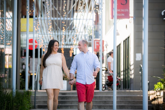 couple walks in downtown at their Fun Austin Engagement Session | Photographer: Adrianne Riley Photography | via https://emmalinebride.com/real-weddings/fun-austin-engagement-session-priscella-jerry/