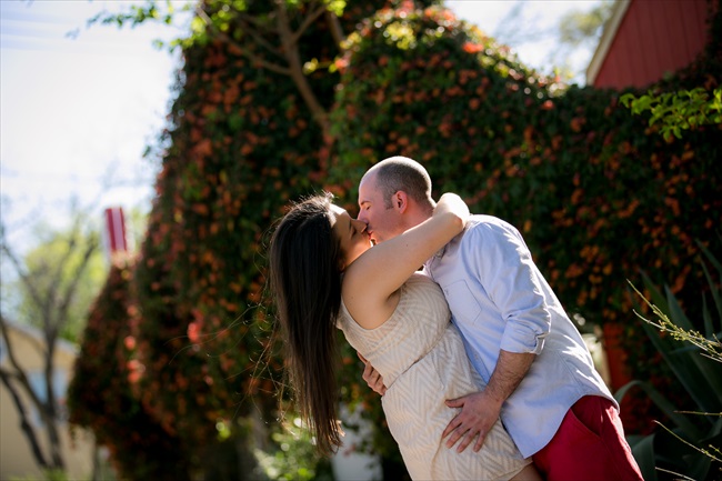 engaged couple kisses at their Fun Austin Engagement Session | Photographer: Adrianne Riley Photography | via https://emmalinebride.com/real-weddings/fun-austin-engagement-session-priscella-jerry/