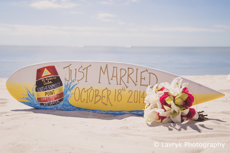 just married surfboard via how to decorate for beach wedding via emmalinebride.com