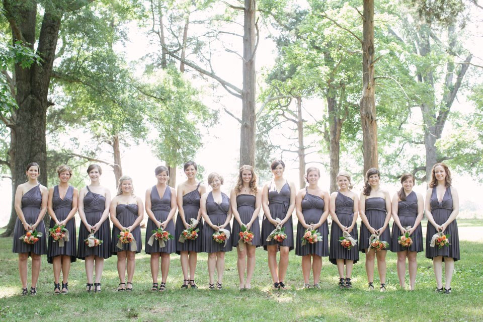 many bridesmaid dresses in charcoal grey infinity style via https://emmalinebride.com/bridesmaids/bridesmaid-dress-worn-different-ways/
