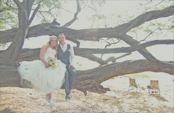 bride and groom show off their Converse wedding kicks at their Maui Beach Wedding