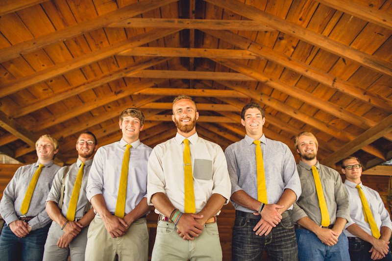 These groomsmen ties are perfectly coordinated to the bridesmaids skirts.  Love the mustard yellow color! | https://emmalinebride.com/bridesmaids/bridesmaid-skirts-hi-low-hem/