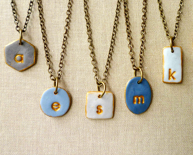 mismatched bridesmaid necklaces in shades of blue | bridesmaid gift ideas https://emmalinebride.com/gifts/bridesmaid-gift-ideas/