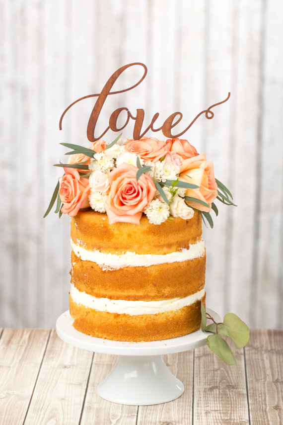 Naked wedding cakes look great as-is, or add a unique topper to add a personalized touch.  This wood cake topper by Better Off Wed Rustics is one of our favorite looks.